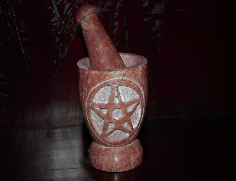 Hand-carved soapstone Mortar and Pestle used to grind your witchy herbs and reins! Hand-made in India, this Mortar and Pestle is 10 cm high and 8 cm in diameter  Please note: Due to the nature of soapstone, each item will vary in colour.